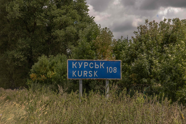 This photograph shows a road sign showing the distance to the Russian town of Kursk next to the destroyed border crossing point with Russia, in the Sumy region, on August 13, 2024, amid the Russian invasion of Ukraine (AFP photo)