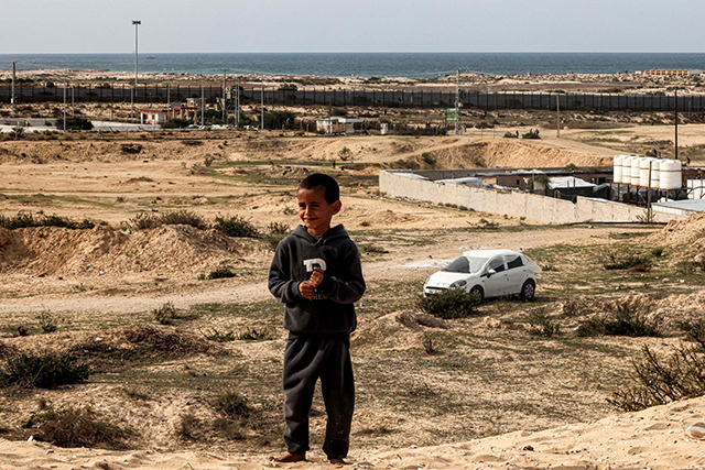 A boy looks on while standing in an open area near tents erected by Palestinians displaced by intense Israeli bombardment on the Gaza Strip, close to the Egyptian border in Rafah in the south of the Palestinian enclave on December 9, 2023 (AFP photo)