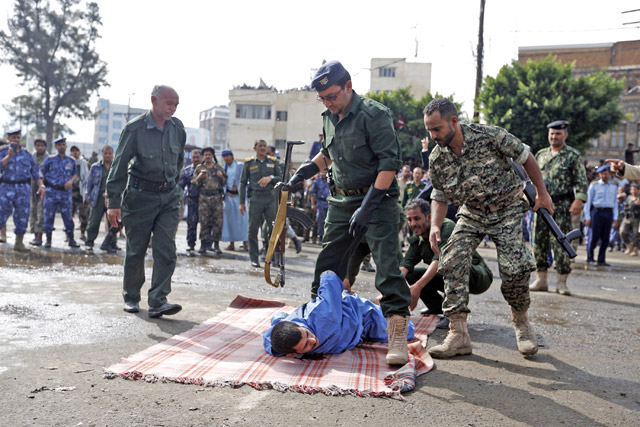 Yemeni security forces prepare to execute a man convicted of raping and murdering a four-year-old girl in the capital Sanaa’s Tahrir Square on Monday (AFP photo)