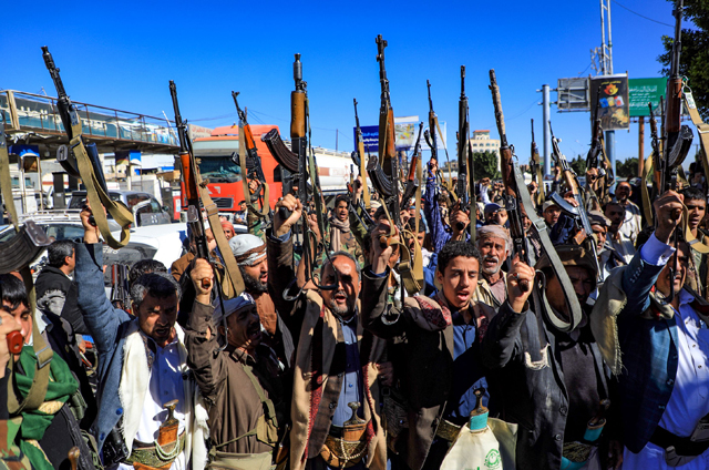 In this file photo taken on January 27, armed Yemeni supporters of the Iran-backed Houthi movement, brandish their weapons as they rally in the capital Sanaa to protest against the Saudi-led coalition's intervention in their country. (AFP photo)
