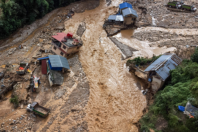 An aerial view shows the area affected by monsoon flooding in Roshi village of Nepal's Kavre district on September 30 (AFP photo)