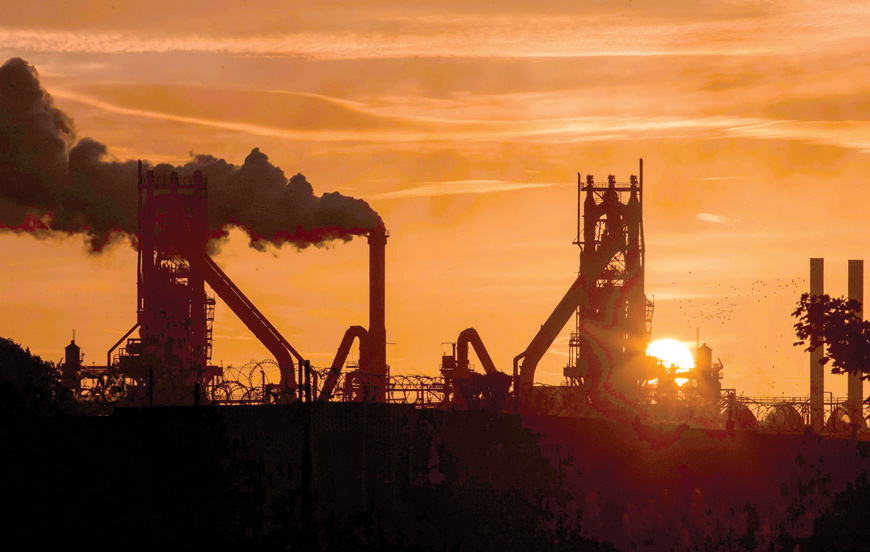 In this photo taken on September 28, 2016, the sun rises behind the British Steel - Scunthorpe plant in north Lincolnshire, north east England  (AFP file  photo)