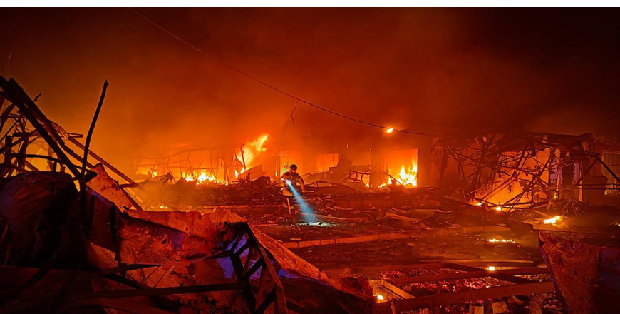 This handout photograph taken and released by the State Emergency Service of Ukraine on Tuesday, shows the State Emergency Service of Ukraine rescuer examines the site of a rocket impact after a missile attack in Mykolaiv (AFP photo)