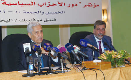 Prime Minister Abdullah Ensour (left) addresses a conference on the role of political parties in parliamentary life in the presence of Minister of Political and Parliamentary Affairs Khaled Kalaldeh on Thursday (Petra photo)