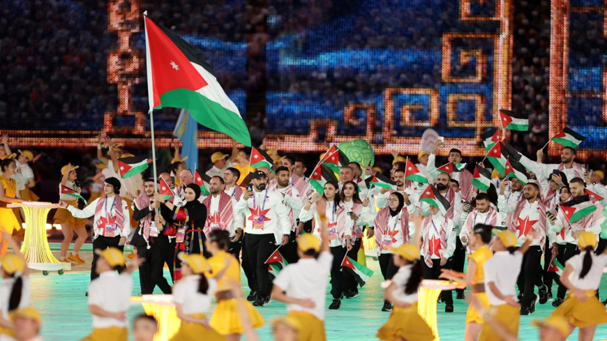Members of the Jordanian delegation take part in the athlete’s parade during the opening ceremony of the 19th Asian Games in Hangzhou, China, on Saturday (Photo courtesy of Jordan Olympic Committee)