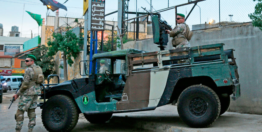Lebanese security forces guard the entrance of Al Ahed Stadium in Beirut's southern suburbs during a tour organised by the Lebanese foreign minister for ambassadors on Monday (AFP photo)