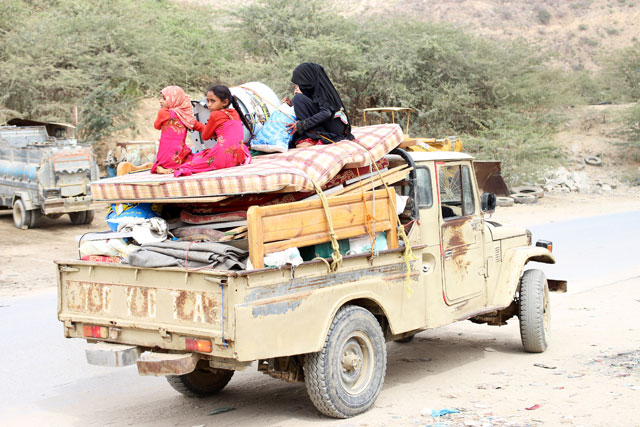 Girls sit atop furniture loaded on a truck as they flee from the fights in Kushar district of the northwestern province of Hajja, Yemen, on Tuesday (Reuters photo) 