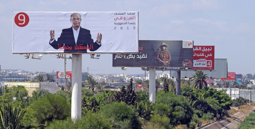   Electoral billboards are pictured along a road in Tunisia's capital Tunis on Saturday, ahead of the Spetember 15 presidential election (AFP photo)