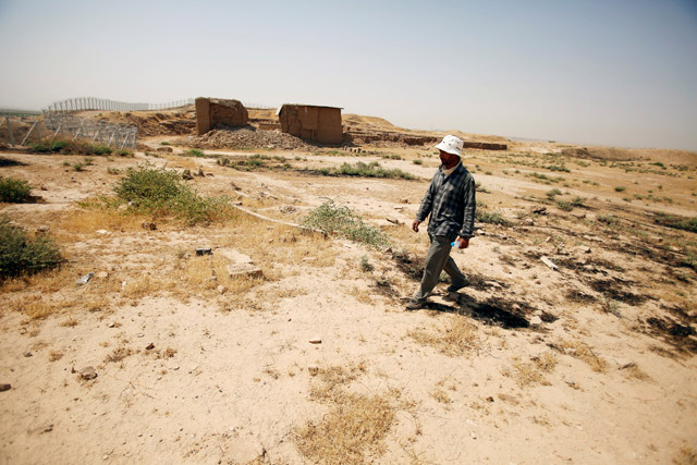 One of the citizens of the Nimrud city refers to the place of Agatha Christie’s former residence in the Nimrud archaeological city in south of Mosul, Iraq, on Tuesday (Reuters photo)