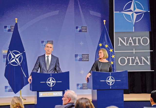 NATO Secretary General Jens Stoltenberg (left) talks to the media with European Union High Representative for Foreign Affairs and Security Policy Federica Mogherini during a NATO Foreign Affairs Ministers’ meeting held at NATO headquarters in Brussels on Tuesday (AFP photo)