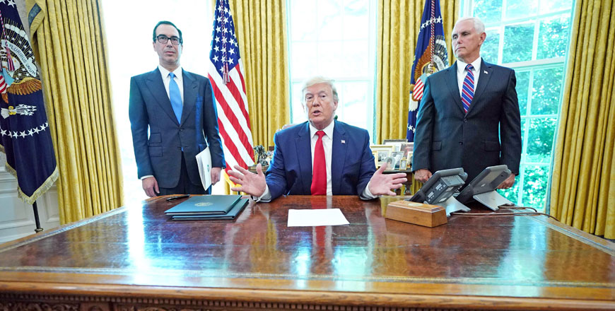 US President Donald Trump speaks with US Vice President Mike Pence (right) and US Secretary of Treasury Steven Mnuchin after signing at the White House on Monday, 'hard-hitting sanctions' on Iran's supreme leader (AFP photo)