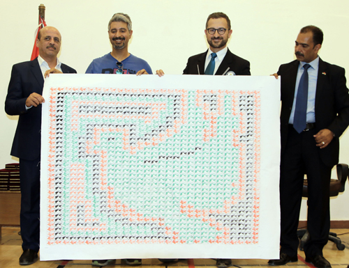 Some 1,015 participants from Sahab used rubber stamps to create a larger image of a dove in the colours of the Jordanian flag (Photo by Osama Aqarbeh)