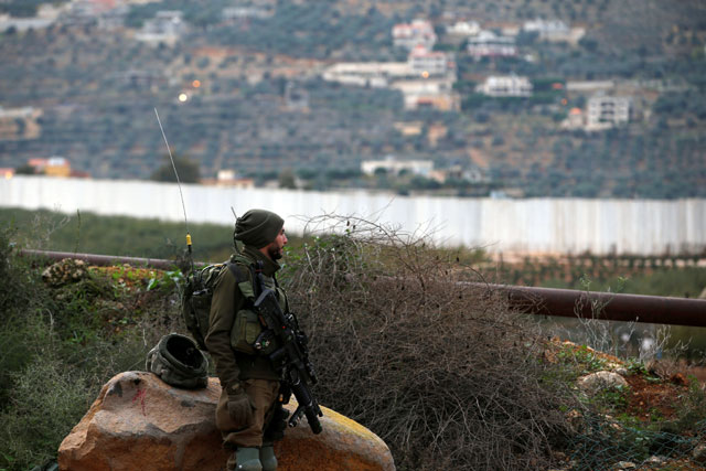 An Israeli soldier guards near the border with Lebanon, the morning after the Israeli forces said they had launched an operation to ‘expose and thwart’  tunnels, on December 5 (Reuters photo)