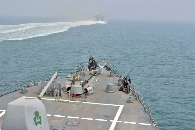 This handout photo from US navy Lt. Daphne White, the US navy guided-missile destroyer USS The Sullivans, and the Military Sealift Command joint high-speed vessel USNS Choctaw County, transit through the Strait of Hormuz on August 8 (Reuters photo)