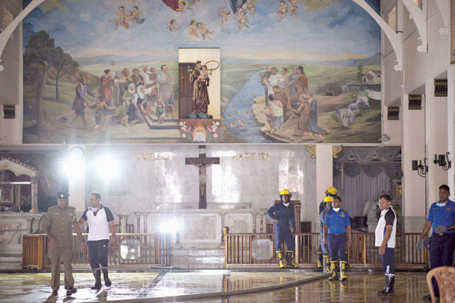 Sri Lankan navy soldiers check electric lines inside St Anthony's Shrine in Colombo on Saturday, following a series of bomb blasts targeting churches and luxury hotels on Easter Sunday in Sri Lanka (AFP photo)