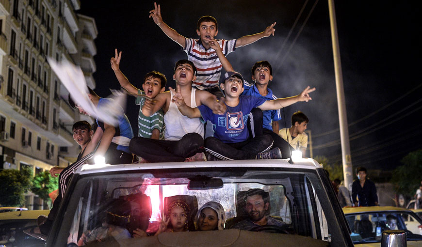 Young supporters of pro-Kurdish Peoples' Democratic Party celebrate in the streets the results of the legislative elections in Diyarbakir on Sunday (AFP photo)