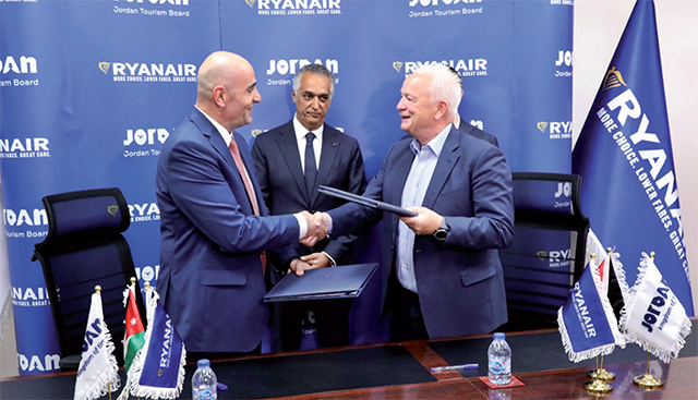 Minister of Tourism and Antiquities and JTB Chairman Makram Queisi, CEO of Ryanair Eddie Wilson (right) and JTB Managing Director Abdul Razzaq Arabiyat (left) during a signing ceremony in Amman on Monday (Photo courtesy of JTB)