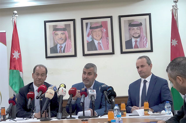 Minister of Energy and Mineral Resources Saleh Kharabsheh speaks during a press briefing along with Media Affairs Faisal Shboul and EMRC Chairman Hussein Laboun in Amman on Thursday (Photo by Batool Ghaith)