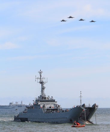 War planes fly over a ship as NATO troops participate in the NATO sea exercises BALTOPS 2015 that are to reassure the Baltic Sea region allies in the face of a resurgent Russia, in Ustka, Poland, on Wednesday (AP photo)