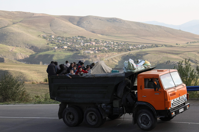 A truck with refugees on board rides on the road between Kornidzor and Goris on Thursday (AFP photo)