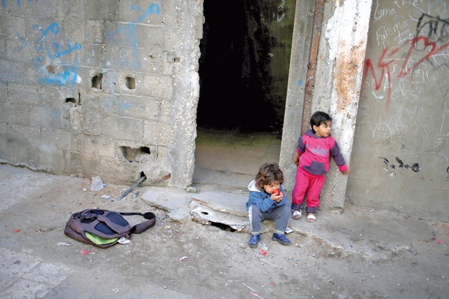 Palestinian children look on outside their house at Shati refugee camp in Gaza City on Wednesday, where an attack on Palestinian Prime Minister Rami Hamdallah was seen as an attempt on national reconciliation efforts (Reuters photo)