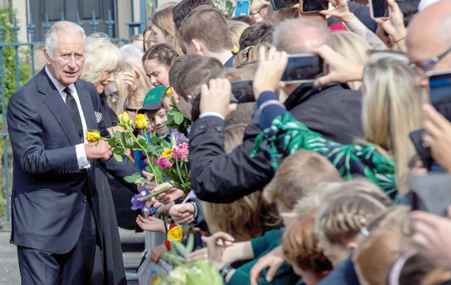 Britain's King Charles III and Britain's Camilla, Queen Consort, greet wellwishers as they arrive at Hillsborough Castle in Belfast on Tuesday, during his visit to Northern Ireland (AFP photo)