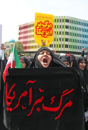 Iranians protest against Trump’s withdrawal decision from Iran nuclear deal after Friday prayer at Tehran University’s campus in Tehran, Iran, on Friday (Anadolu Agency photo)