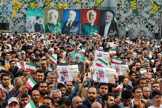 Supporters attend an election campaign rally by Iranian presidential candidate and ultraconservative former nuclear negotiator Saeed Jalili in the capital Tehran, on Monday, ahead of the upcoming Iranian presidential election (AFP photo)