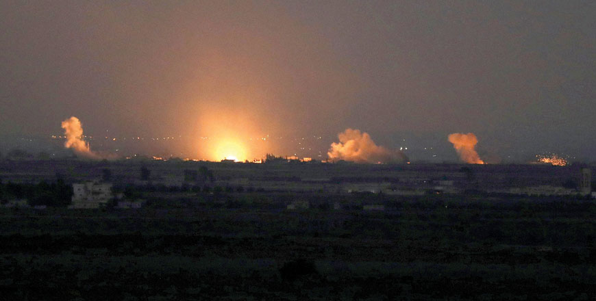 In this file photo, fire follows an explosion at the Syrian side of the Israeli Syrian border as it is seen from the Israeli-occupied Golan Heights on July 26 (Reuters photo)