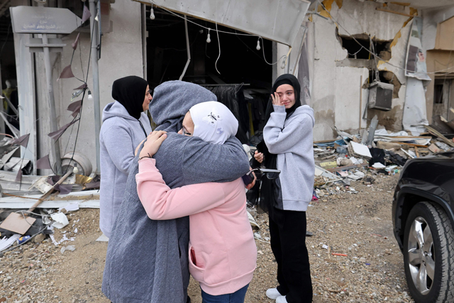 Women greet each other as displaced people make their way back to their homes in the south of Lebanon after a ceasefire between Israel and Hezbollah took effect, on November 27, 2024, in the southern town of Qana (AFP photo)