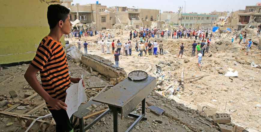 People inspect a debris removal after an explosion near a mosque in Baghdad’s Sadr City district, Iraq, on June 07 (Anadolu Agency photo)