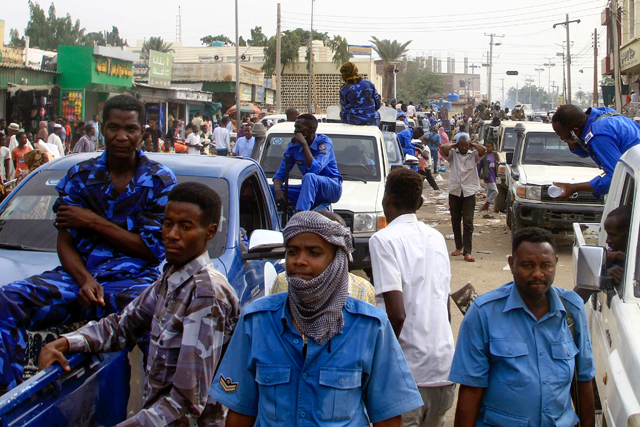 Sudanese security forces deploy along a street in Gedaref city in eastern Sudan, on Wednesday (AFP photo)