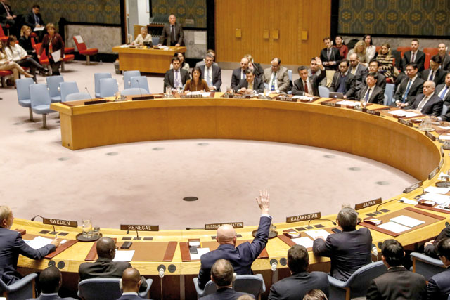 Russian Ambassador to the United Nations Vasily Nebenzya votes against a bid to renew an international inquiry into chemical weapons attacks in Syria, during a meeting of the UN Security Council in New York, on Friday (Reuters photo by Brendan McDermid)