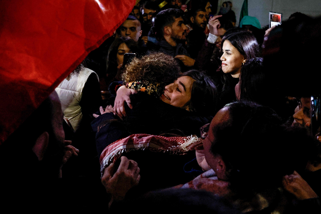 A newly released Palestinian prisoner Rouba Assi hugs relatives during a welcome ceremony for prisoners freed from Israeli jails in exchange for Israeli hostages released by Hamas from the Gaza Strip, during a welcome ceremony in Ramallah in the occupied West Bank on Tuesday (AFP photo)
