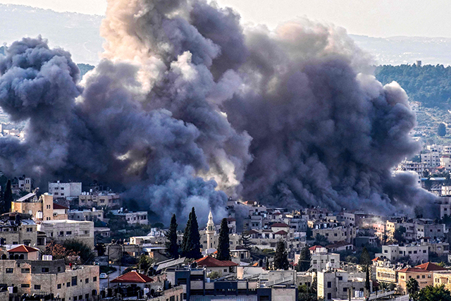 Smoke billows from the site of several explosions during an Israeli raid in the occupied West Bank city of Jenin on February 2, 2025 (AFP photo)