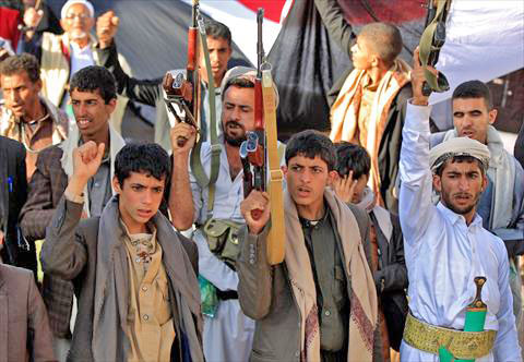 Supporters of Yemen's Shiite Houthi rebels chant slogans and raise Kalashnikov assault rifles as they gather for a rally in support of the group in the Houthi-held capital Sanaa on October 4 (AFP photo)