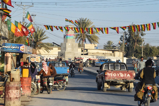 Commuters ride along a street at Panjgur district in Balochistan province on Wednesday (AFP photo)