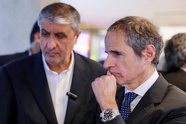 This handout photo made available by the Atomic Energy Organisation of Iran (AEOI) office shows the the head of the AEOI Mohammad Eslami (left) touring with the Director-General of the International Atomic Energy Agency (IAEA) Rafael Grossi  at the organisation headquarters in Tehran on Thursday (AFP photo)