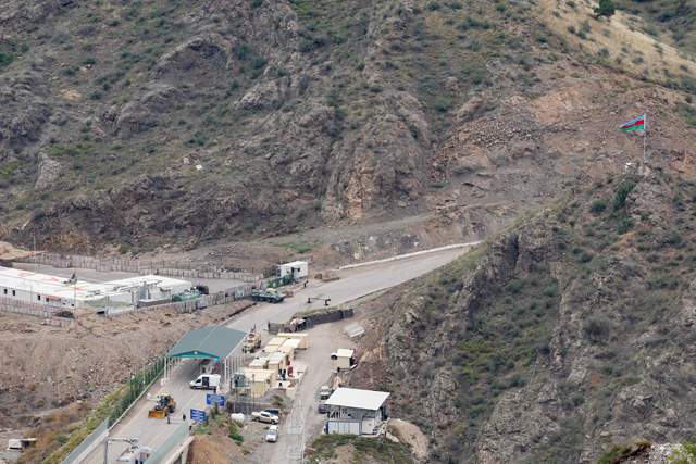 This photograph taken from the Armenian side of the border near the town of Kornidzor on Saturday shows a general view of the Azerbaijani checkpoint set up at the entry of the Lachin corridor, in Azerbaijan's controlled region of Nagorno-Karabakh (AFP photo)