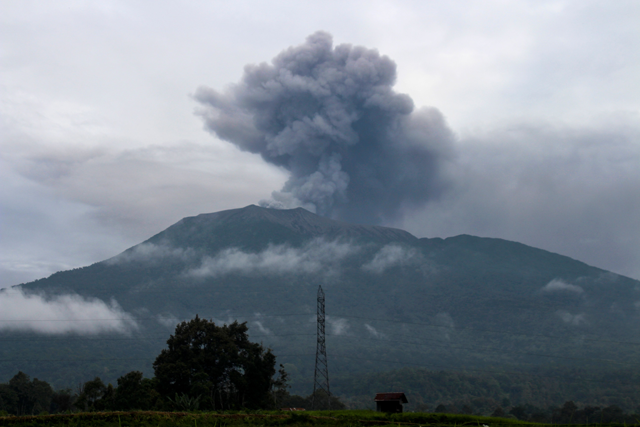 Volcanic ash spews from Mount Marapi during an eruption as seen from Batu Palano village in Agam on Monday (AFP photo)