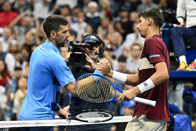 Serbia’s Novak Djokovic (left) greets Australia’s Alexei Popyrin after his defeat during their men’s singles third round match on day five of the US Open tennis tournament at the USTA Billie Jean King National Tennis Cente in New York City, on Saturday (AFP photo)
