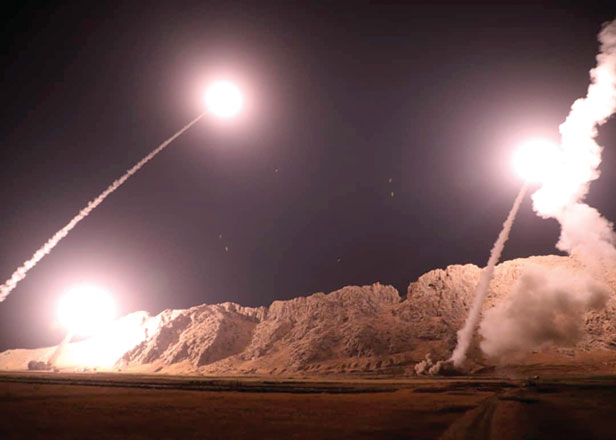 Iran's Revolutionary Guard launch missiles from an undisclosed location to target militants in eastern Syria early on Monday (AFP photo)