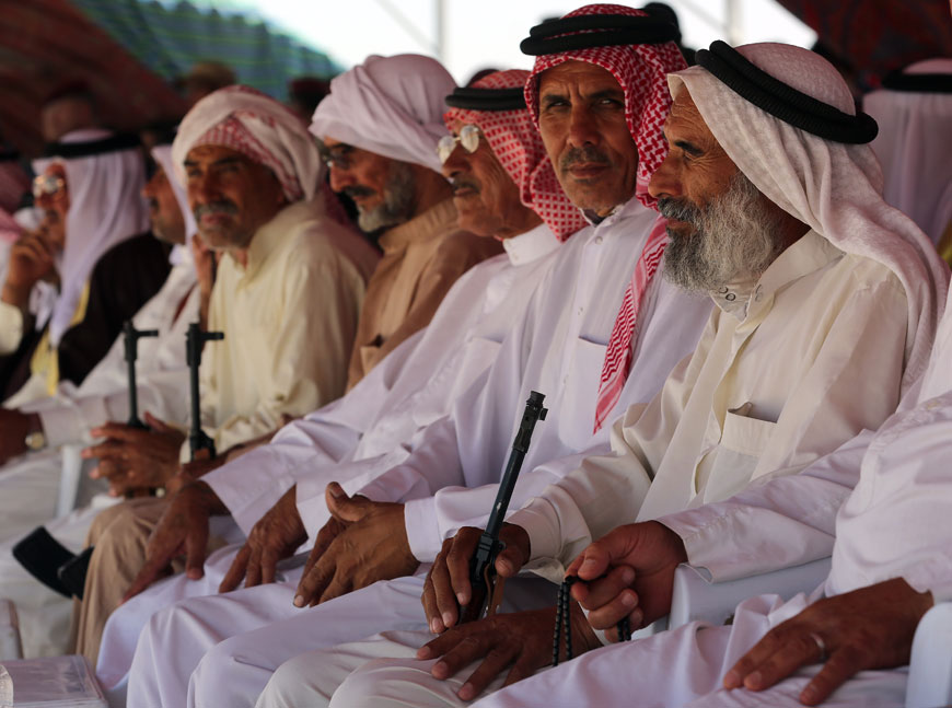 Sunni tribal leaders attend the graduation ceremony of Sunni tribal volunteers in Habaniyah, 80km west of Baghdad, on Wednesday (AP photo by Khalid Mohammed )