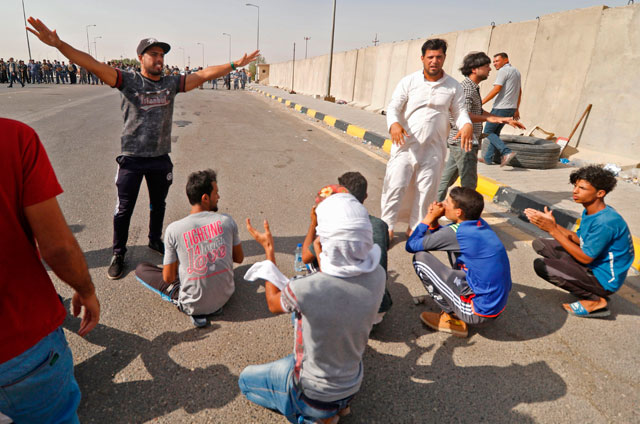 Iraqi protesters demonstrate against unemployment and a lack of basic services outside the oil fields of Al Zubayr, about 20 kilometres southwest of the southern city Basra on Tuesday (AFP photo)