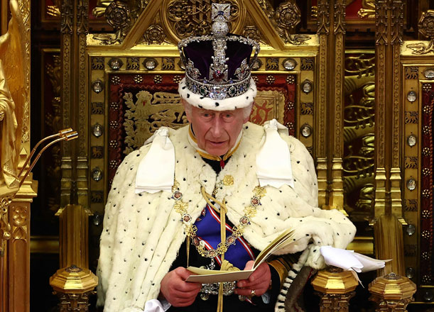 Britain’s King Charles III, wearing the Imperial State Crown and the Robe of State, reads the King’s Speech from the The Sovereign’s Throne in the House of Lords chamber, during the State Opening of Parliament, at the Houses of Parliament, in London, on Wednesday (AFP photo)
