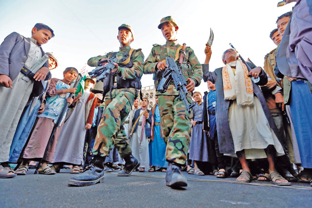 Yemeni Houthi rebel fighters march during a rally celebrating the death of Yemeni ex-president Ali Abdullah Saleh a day after he was killed, in the capital Sanaa, on Tuesday (AFP photo)