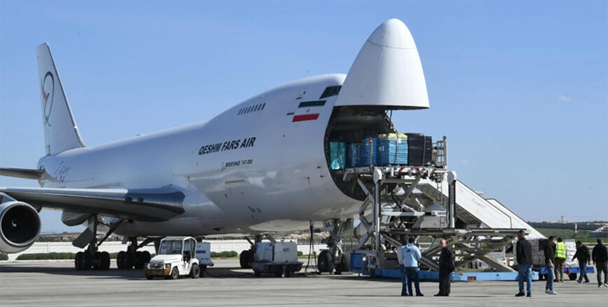 Humanitarian aid from Iran for survivors of a February earthquake is unloaded at Aleppo airport, after it reopened following a previous Israeli air strike in March (AFP photo)