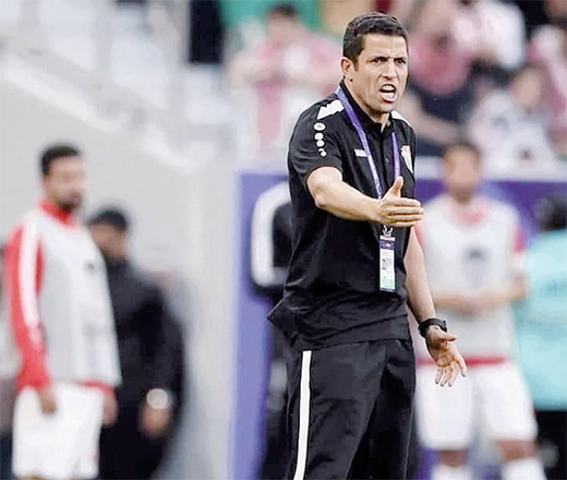 Jordanian coach Hussein Amouta instructs Jordanian players during AFC Asian Cup held in Qatar. Amouta was appointed the coach of the national team in June 2023 leading The Nashama to the second place at the Asian Cup (Photo courtesy of Jordanian Football Federation)