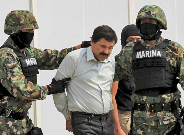 Joaquin ‘Shorty’ Guzman is escorted by soldiers during a presentation at the navy's airstrip in Mexico City in this February 22, 2014 file photo (Reuters photo)