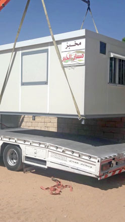 A donated prefabricated bakery is unloaded at a village near Aqaba earlier this year as several bakeries in the area went out of business after the bread subsidiary was lifted (Photo courtesy of Harbi Huweitat)